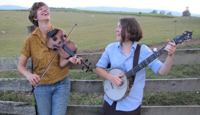 Anna and Elizabeth with fiddle and banjo, photo by Mike Melnyk